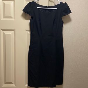 Gianni Bini structured black dress with cap sleeves.